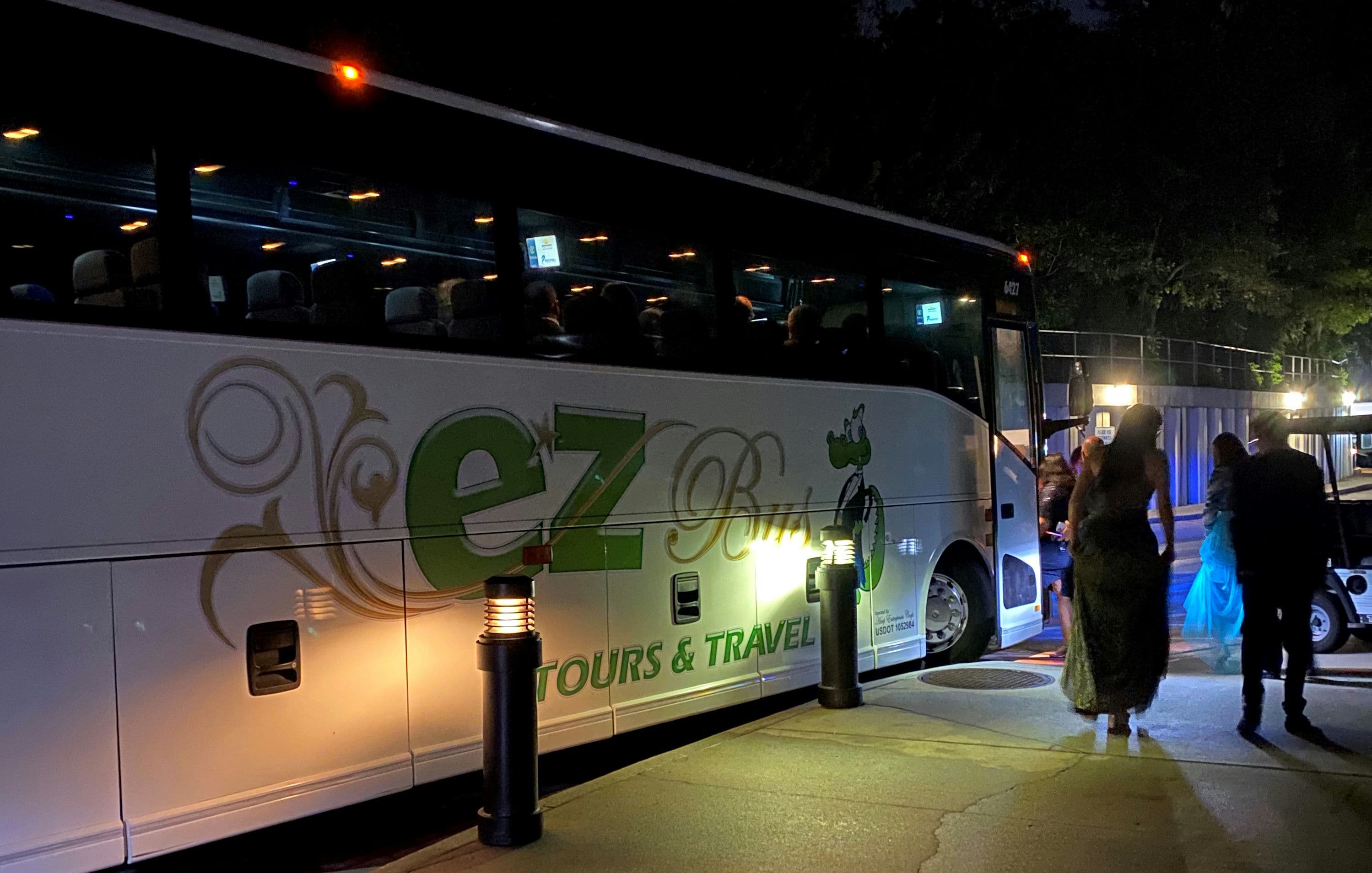 Guests boarding an EZ Bus coach at an evening gala